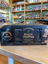Packaged black truffle Entertainers Wafers in a retail shop