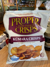 Packaging of Proper Hand Cooked Crisps with Kumara Crisps flavor on a wooden surface.