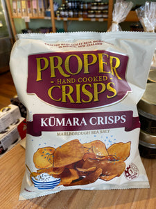 Packaging of Proper Hand Cooked Crisps with Kumara Crisps flavor on a wooden surface.