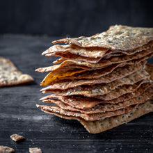Stack of crackers on a dark surface